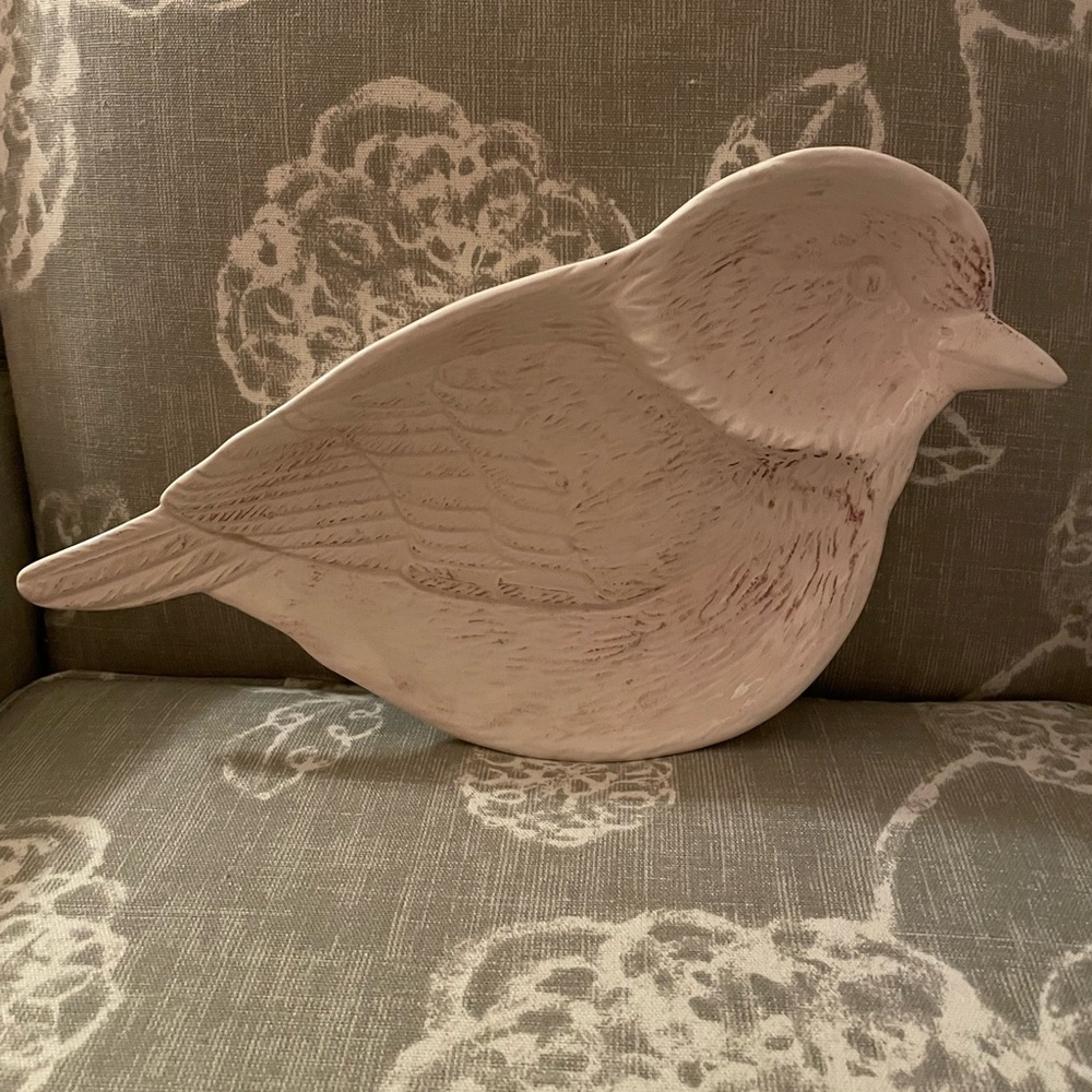 Adorable cream colored bird holder.